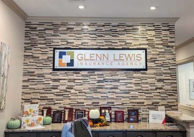 Glenn Lewis Insurance Agency ADA interior sign.